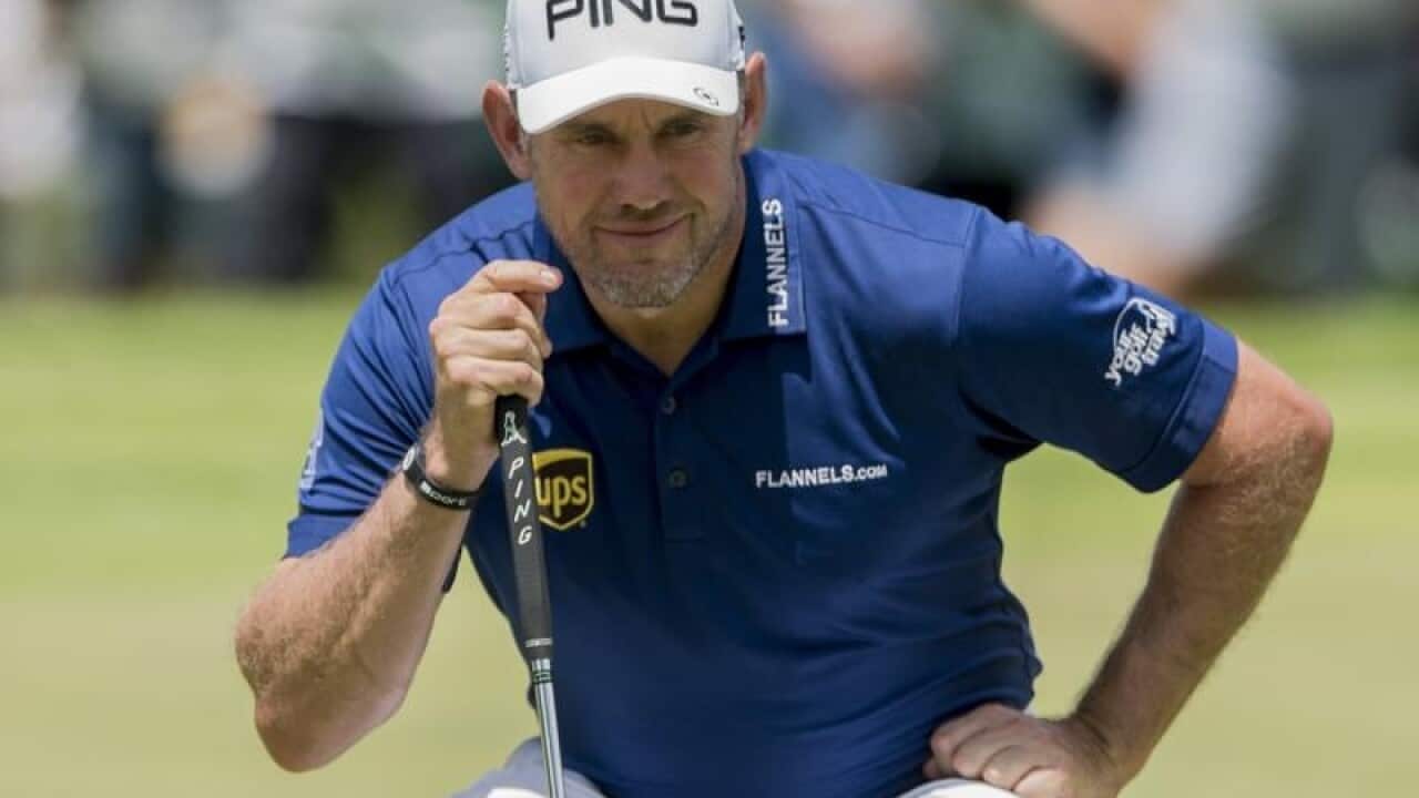 Lee Westwood of England lines up a putt