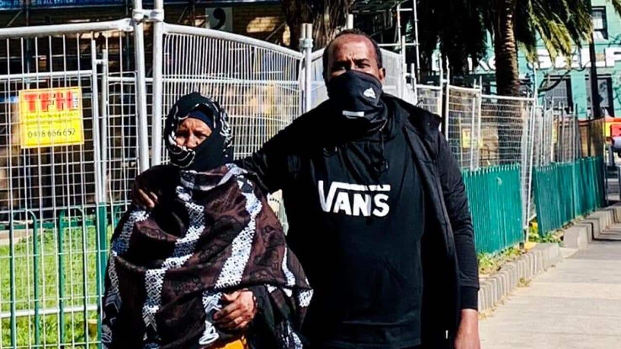 Abdullahi Ahmed and his 89-year old mother, Hawa outside their apartment building in Flemington, Melbourne