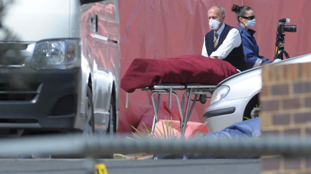 The coroner removes the body of a Melbourne terror suspect