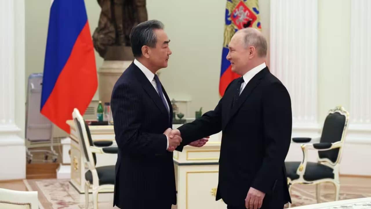 Russian President Vladimir Putin meets with China's Director of the Office of the Central Foreign Affairs Commission Wang Yi .jpg
