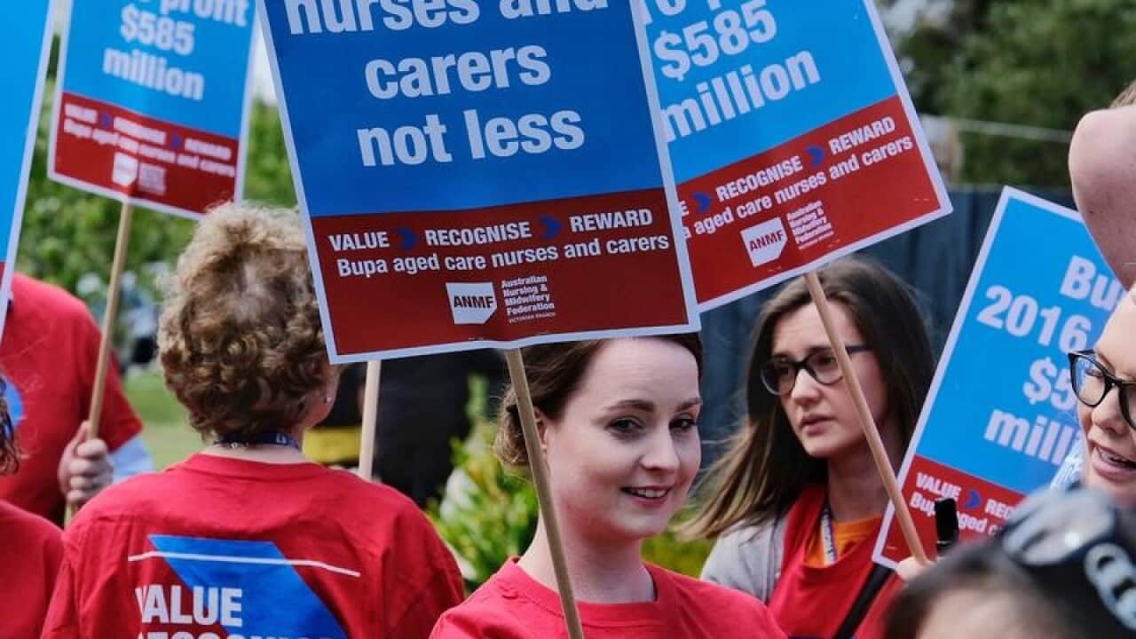 Bupa nurses and carers protest outside a Bupa Age Care home.