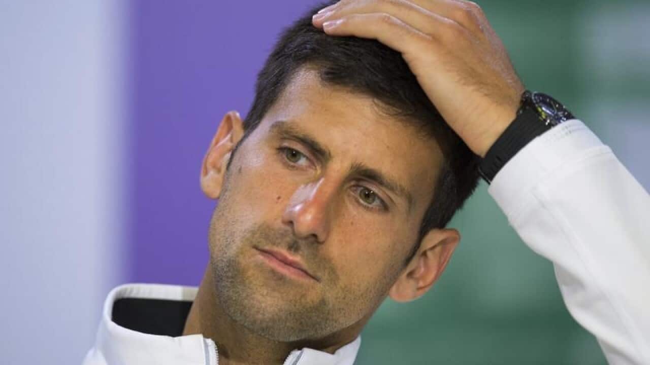 Novak Djokovic as he gestures during a press conference