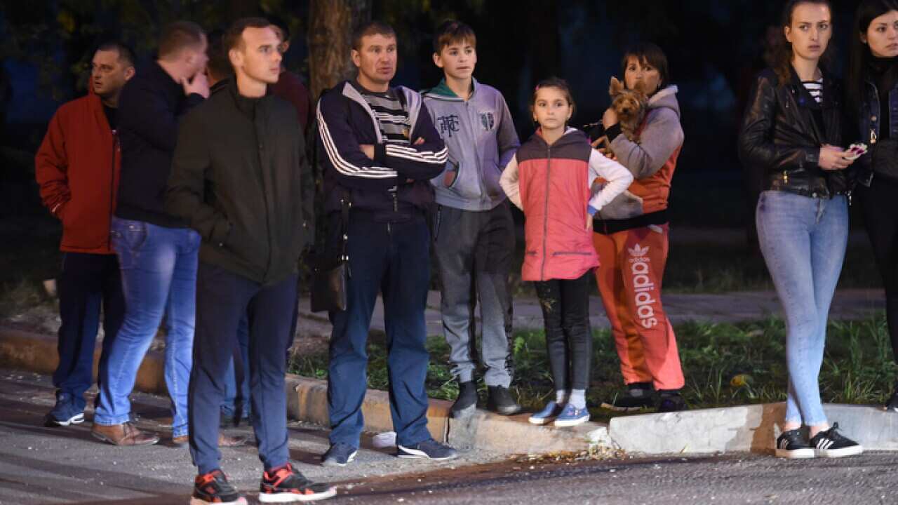 Residents gather near the college in Kerch