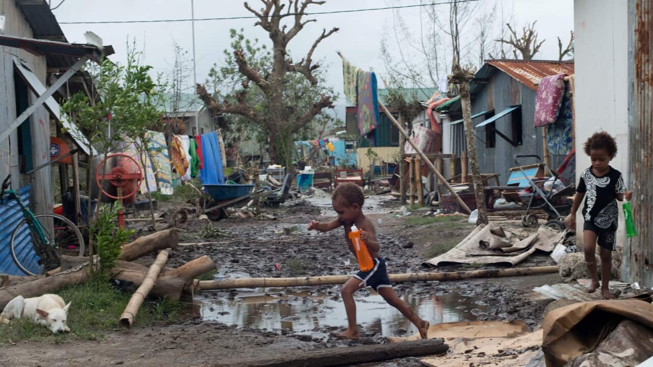Children play amidst rubble in a street after Cyclone Pam hit Vanuatu island, 15 March 2015. (EPA/GRAHAM CRUMB/UNICEF PACIFIC)