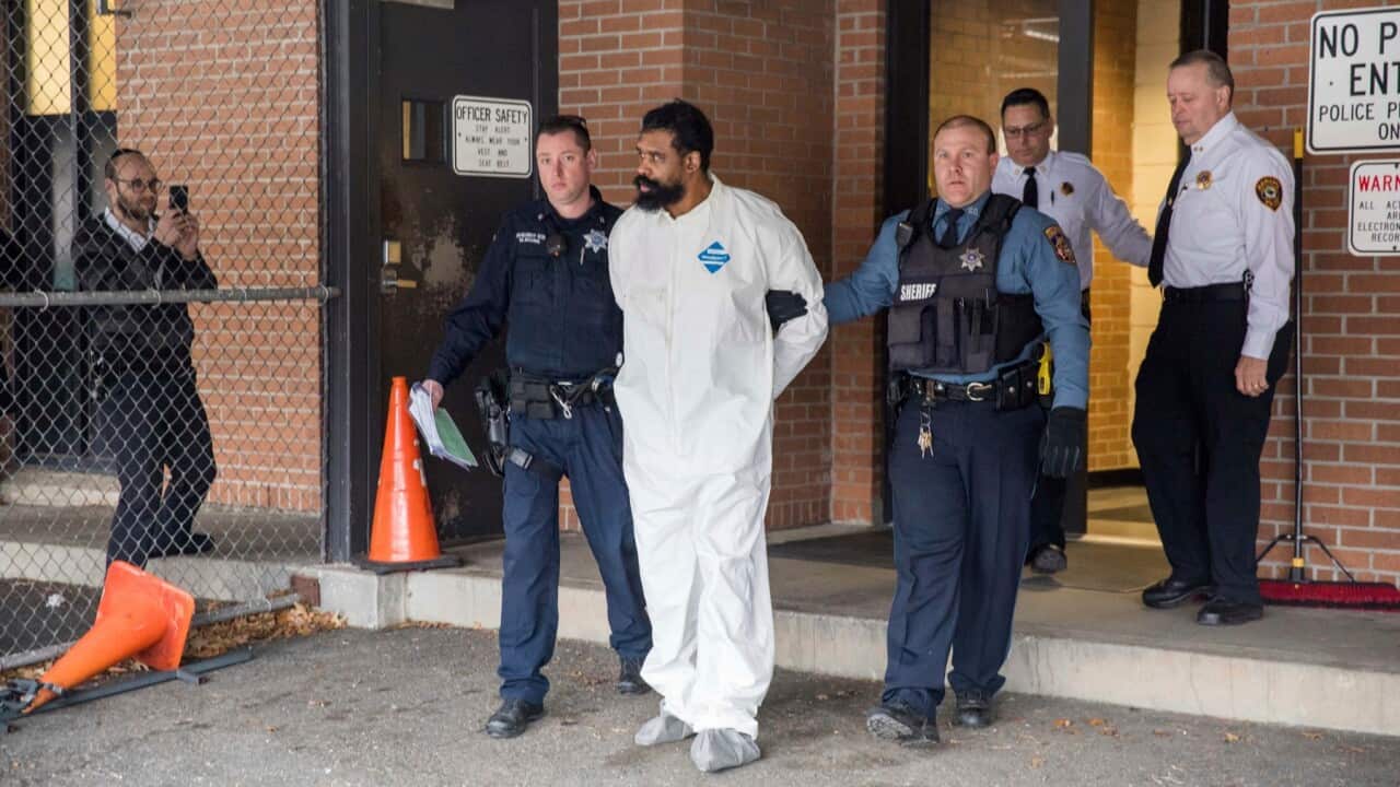 Grafton Thomas, accused of the New York Hannukah stabbing incident, is escorted by police