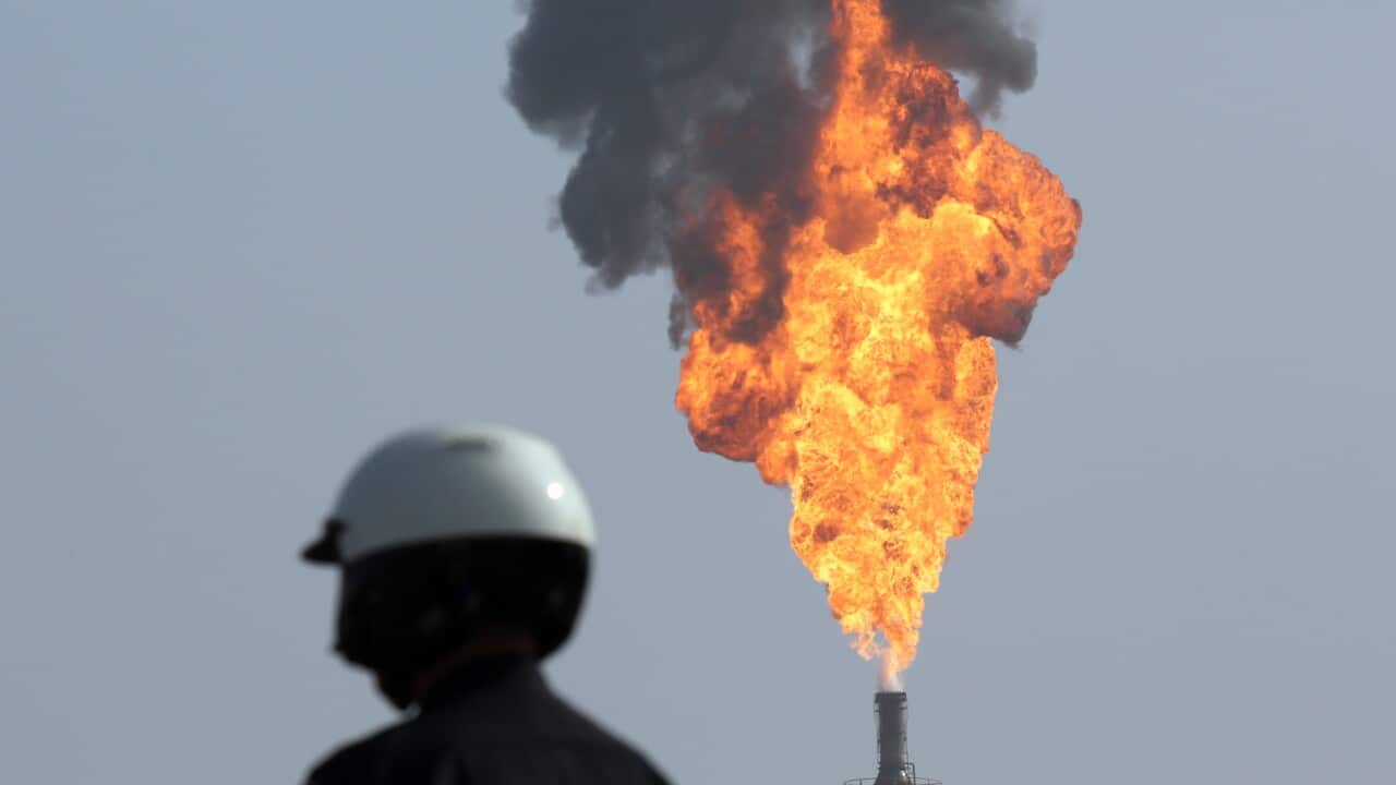 A large smokestack flare burns at a processing facility at the ExxonMobil refinery in Torrance, California, on Wednesday, February 18, 2015.