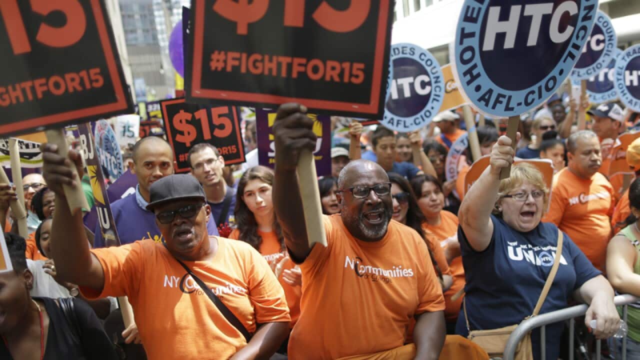 Activists during a rally for increases to minimum wage in New York
