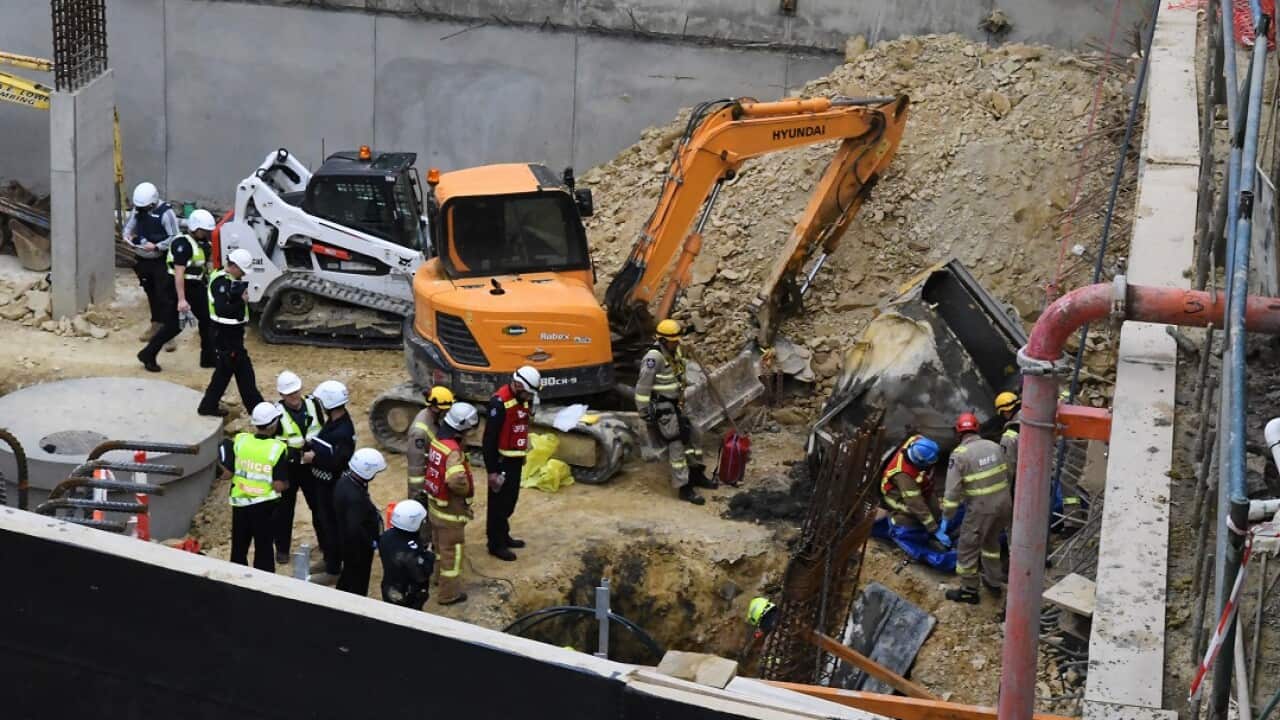 Emergency service workers are seen at the scene of an accident at a construction site in Box Hill, Melbourne.