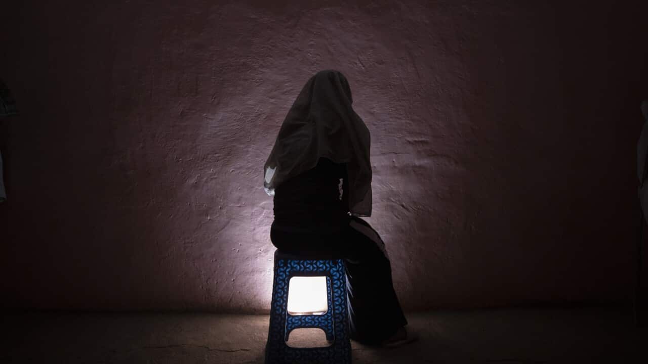 A Tigrayan refugee sits for a portrait in eastern Sudan near the Sudan-Ethiopia border in March 2021