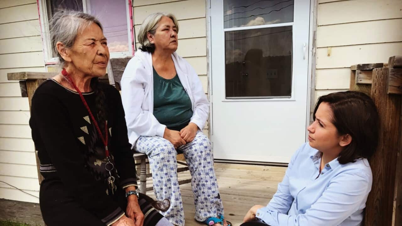 Reporter Laura Murphy-Oates (R) talks to Thelma Favel (M) the great aunt of murdered girl Tina Fontaine, and First Nations' elder Myrelene Ranville (L).