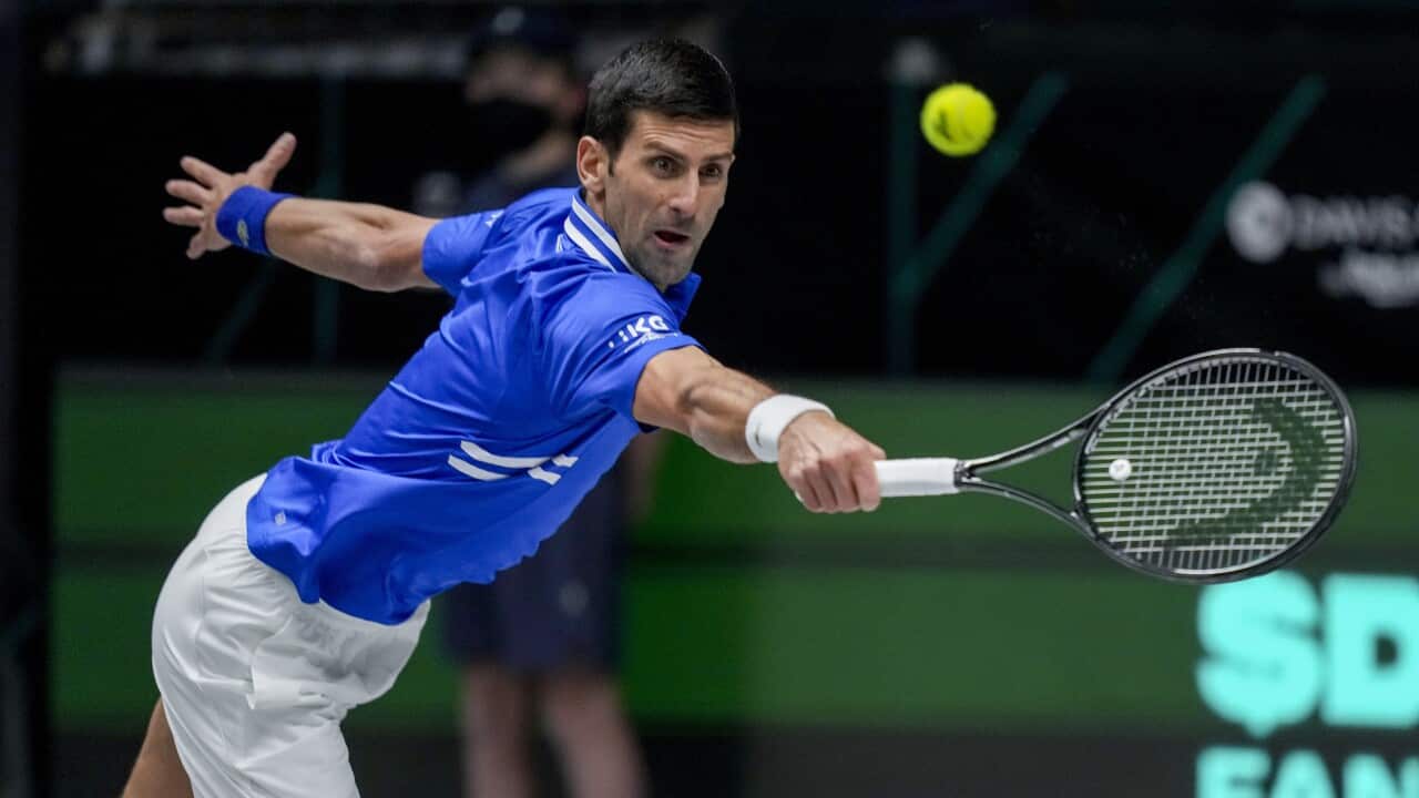Serbia's Novak Djokovic hits a backhand against Austria's Dennis Novak during a Davis Cup group F match between Serbia and Austria in Innsbruck, Austria, Friday, Nov. 26, 2021. (Photo/Michael Probst)