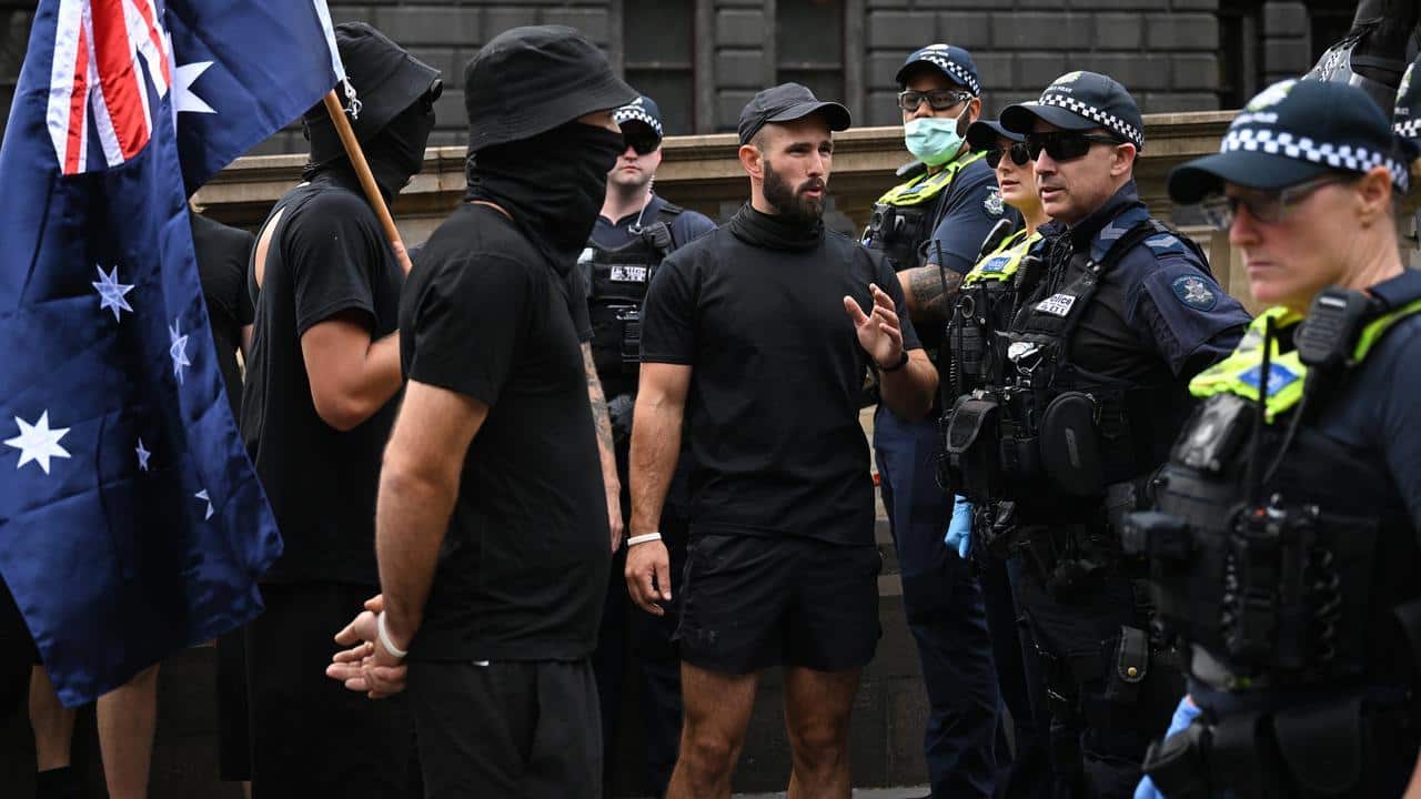 National Socialist Movement members and police faced off outside the Victorian parliament. (James Ross/AAP PHOTOS)