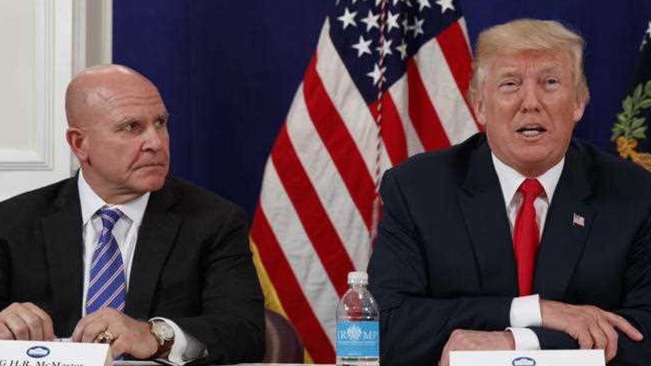 National Security Adviser H.R. McMaster listens as President Donald Trump speaks to reporters after a security briefing in August, 2017.