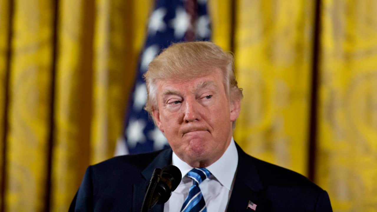 US President Donald Trump speaks during a swearing in ceremony of White House senior staff in the East Room of the White House on 22 January 2017.