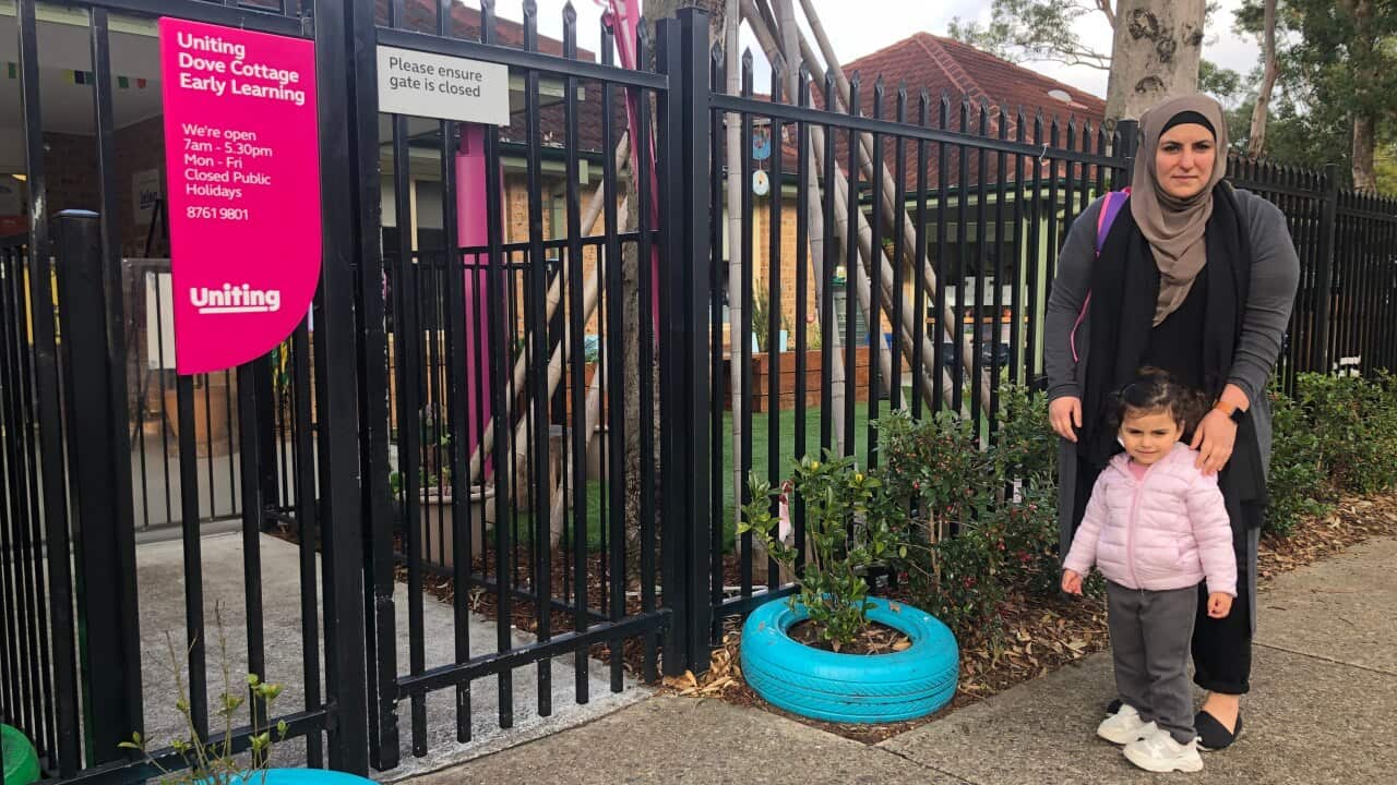 Iman Alomari walks Nora into the childcare centre