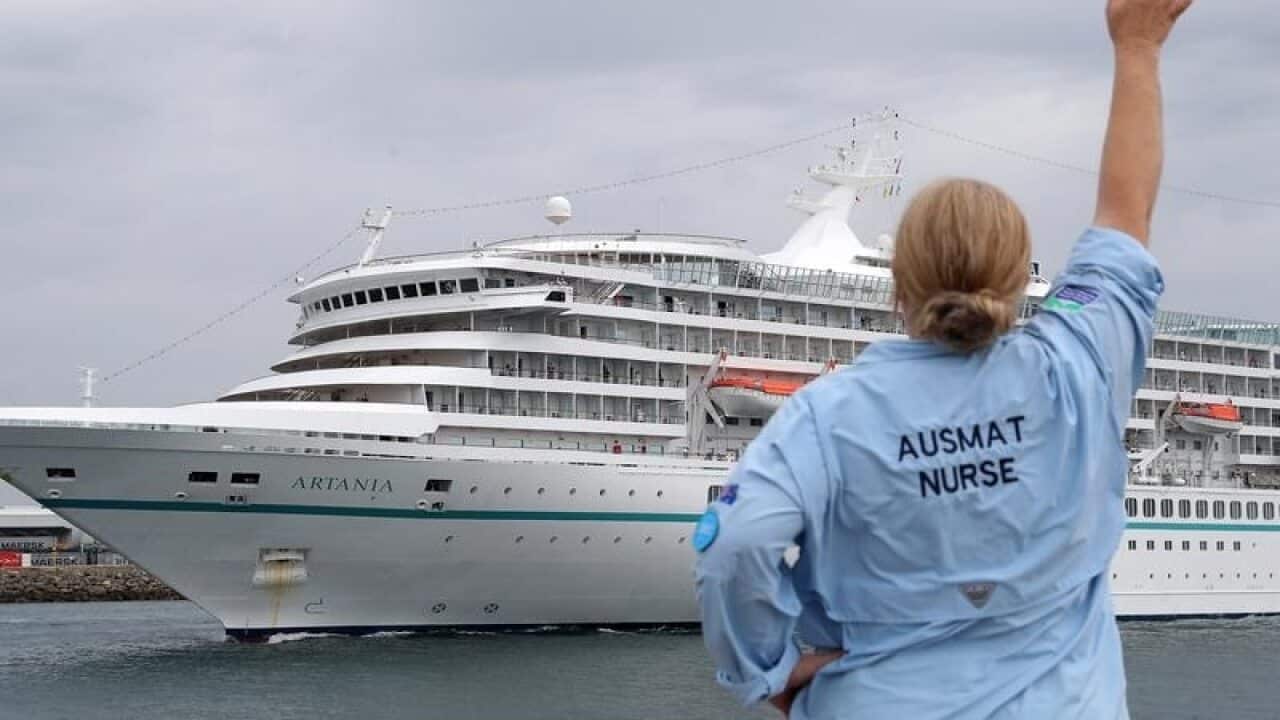 AUSMAT staff waving at the Artania cruise ship.