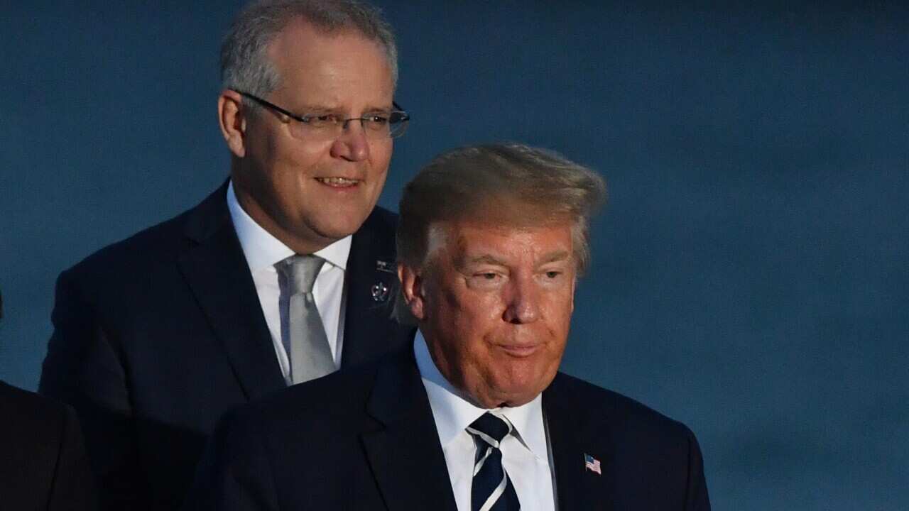 U.S. President Donald Trump and Australia's Prime Minister Scott Morrison at the family photograph during the G7 Summit in the town of Biarritz, 800km south of Paris in France, Sunday, August 25, 2019. (AAP Image/Mick Tsikas) NO ARCHIVING