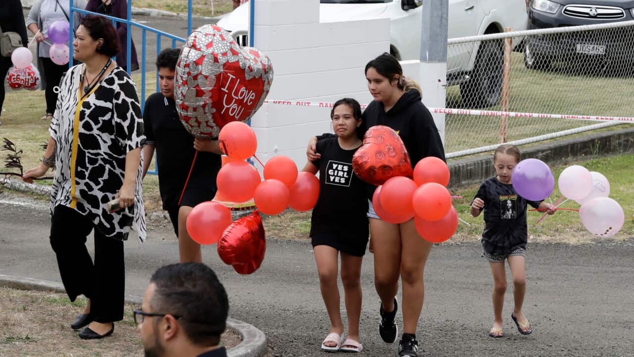 Families of victims of the White Island eruption following a blessing at sea ahead of the recovery operation