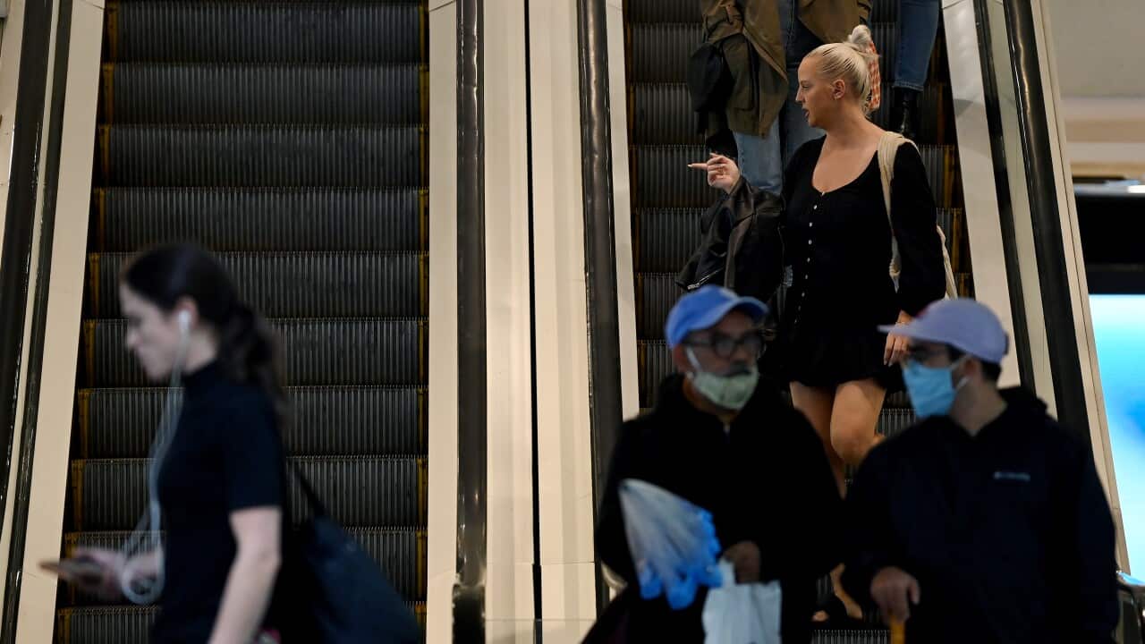 Shoppers are seen without face masks on in Sydney, where restrictions have been eased in recent days