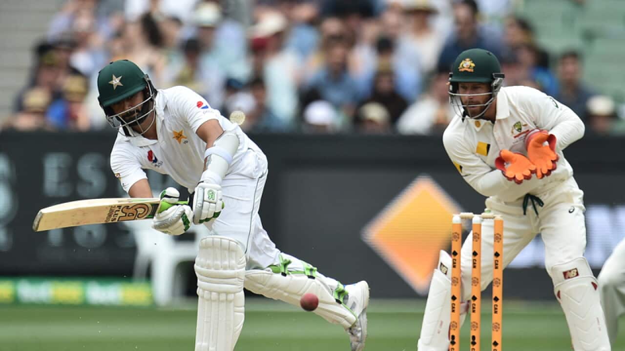 Azhar Ali of Pakistan (left) plays a shot