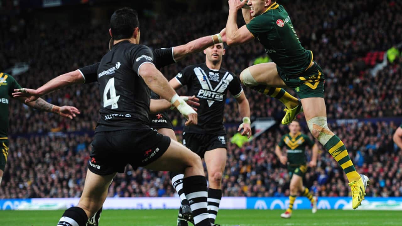 Australia's Billy Slater outjumps New Zealand's Kieran Foran