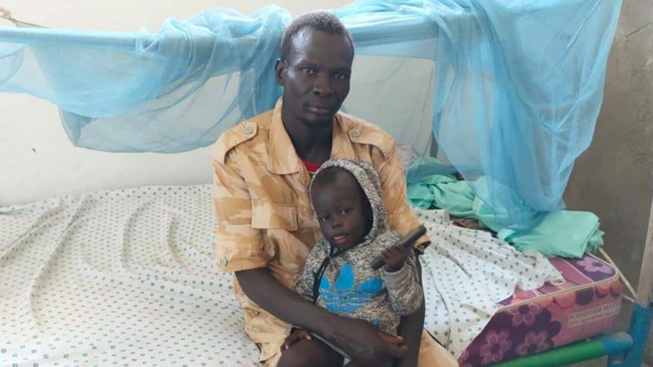 Majok Monydhar and 1 year old and nine months daughter