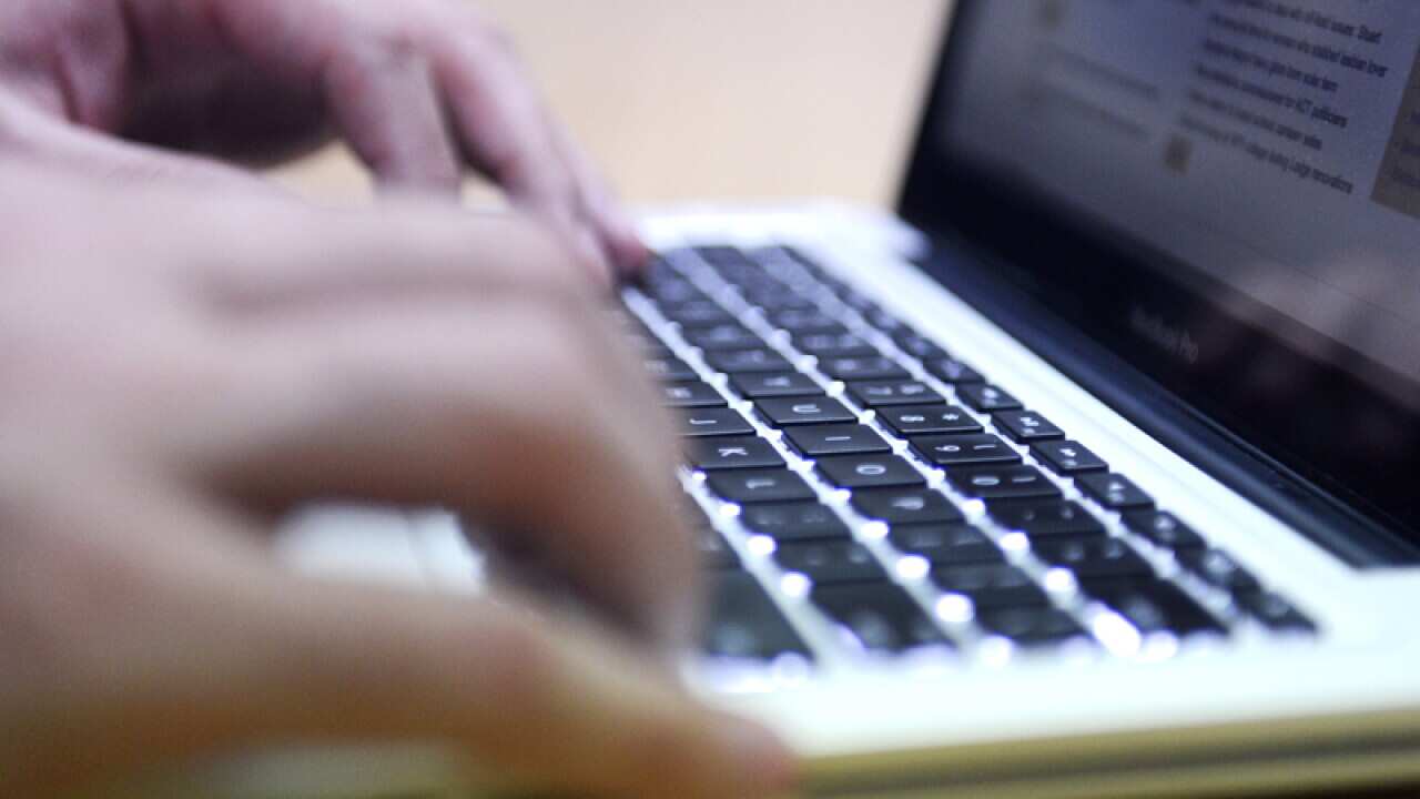 A stock image of a man using a computer.