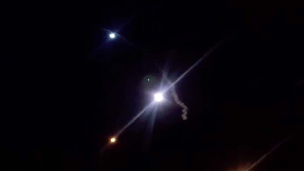 A screengrab from Iranian TV shows rockets launched against a US military base in Iraq