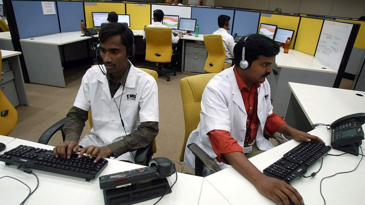 Indian staff work at a call centre.