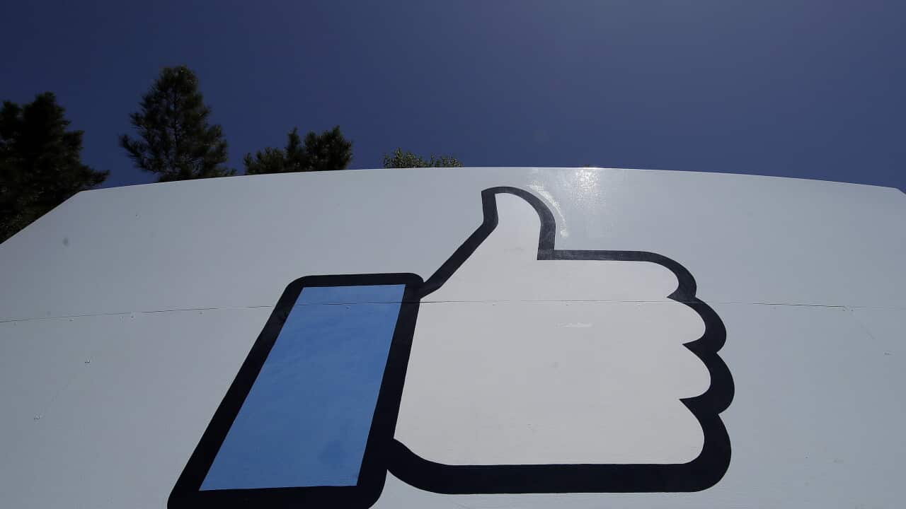 : FILE, April 25, 2019, file photo shows the thumbs-up Like logo on a sign at Facebook headquarters in Menlo Park, California