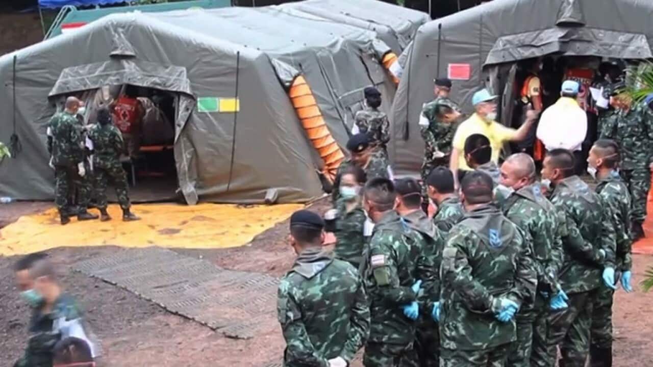 Thai military personnel prepare to move the boys from a youth football team from the cave to a hospital.