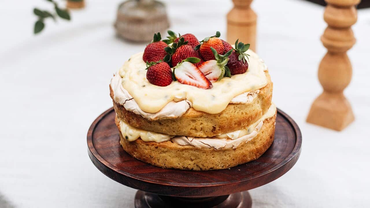 Stacked passionfruit and lemon pavlova cake