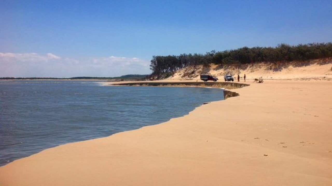 A sinkhole the size of a football field that has opened up at Jumpinpin beach on North Stradbroke Island.