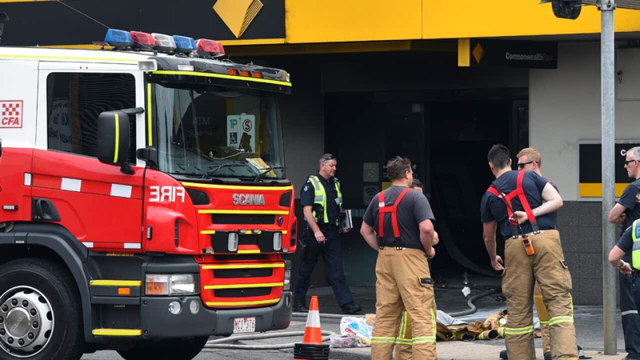 Emergency service workers are seen at the Commonwealth Bank