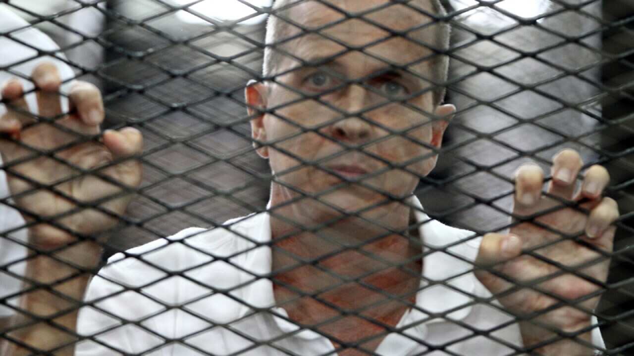 Australian journalist Peter Greste at a court in Cairo