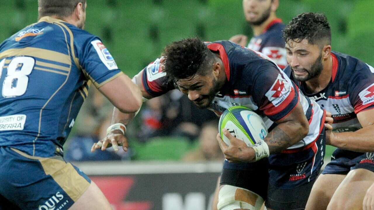 Amanaki Mafi of the Rebels charges through the Brumbies back line