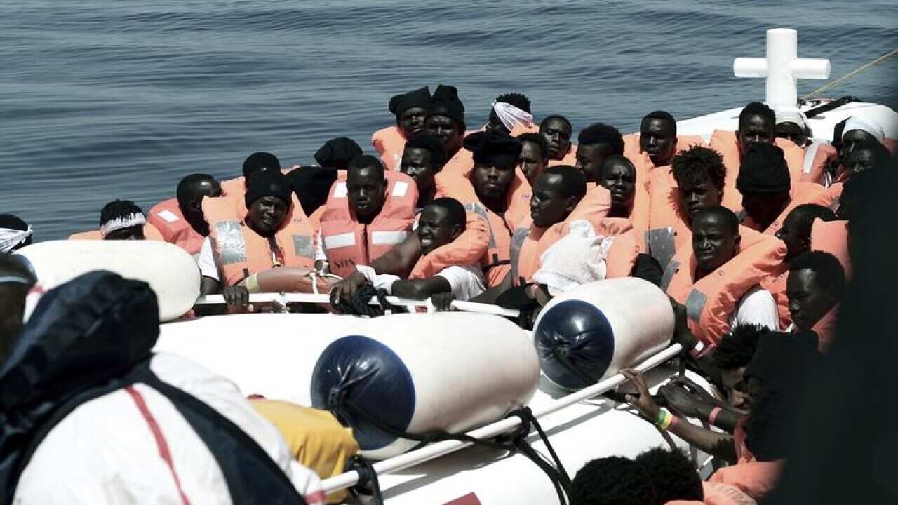 Migrants transfer from the overcrowded Aquarius.