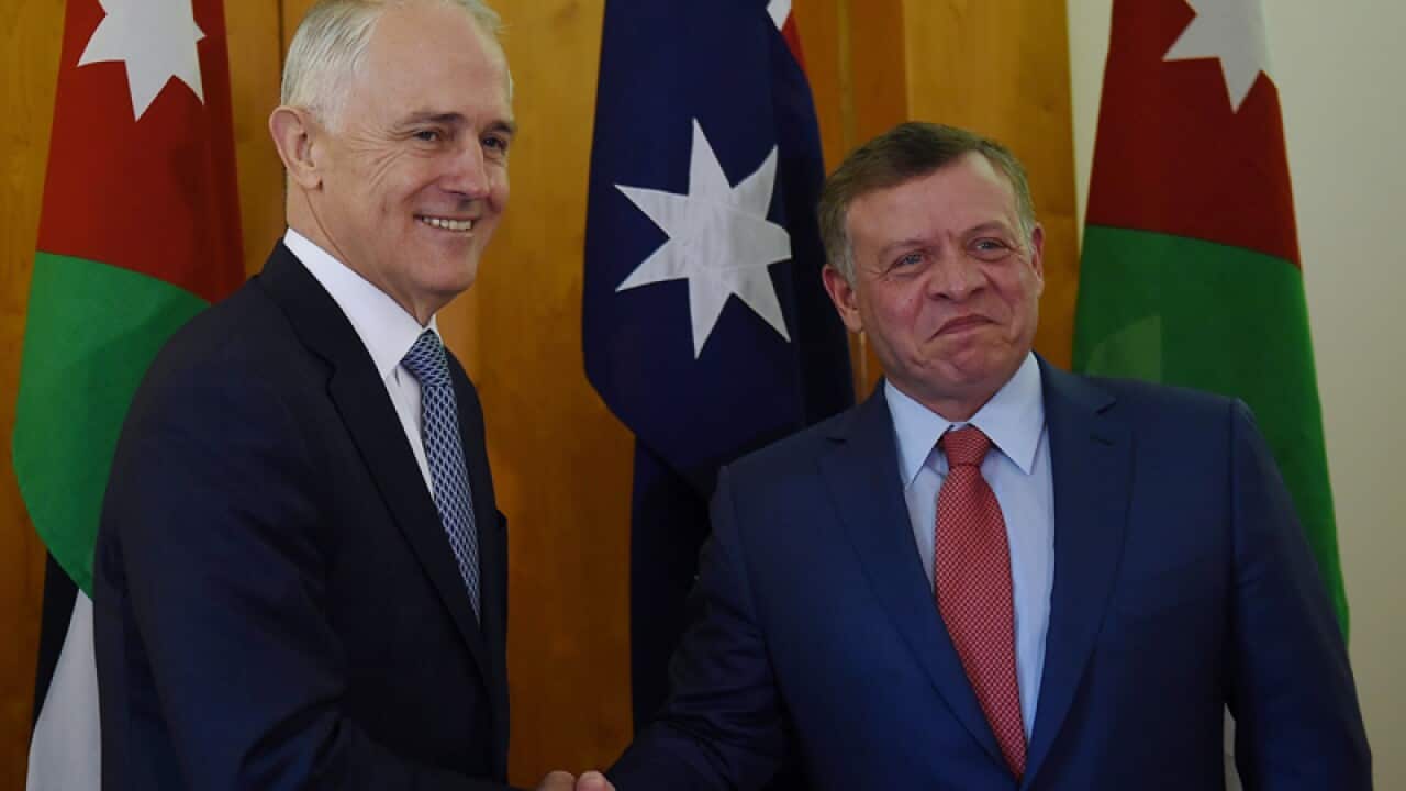 Jordanian King Abdullah ll (right) shakes hands with Malcolm Turnbull