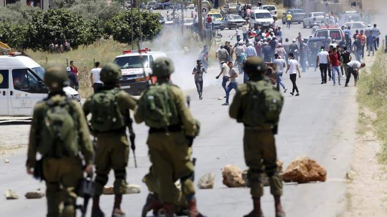 Israeli soldiers take position during clashes with Palestinian protesters after a protest in support of Palestinian prisoners on hunger strike in Israeli jails (AAP)