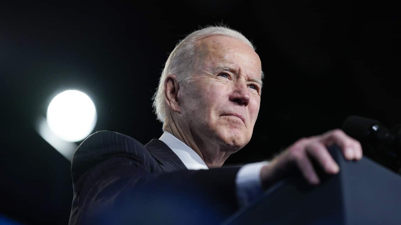 US President Joe Biden at a lecturns