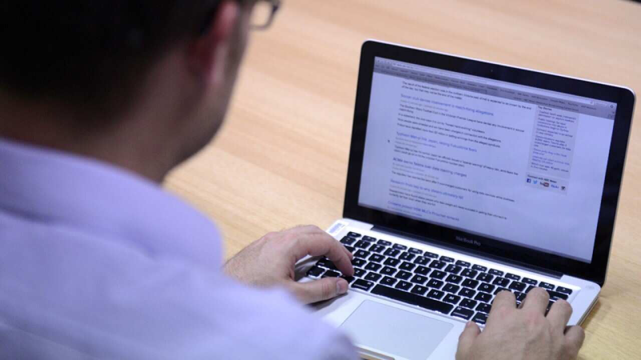 A man uses a laptop