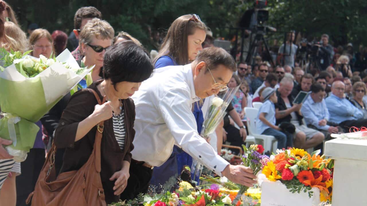 Parents, center, of a Japanese victim in an earthquake