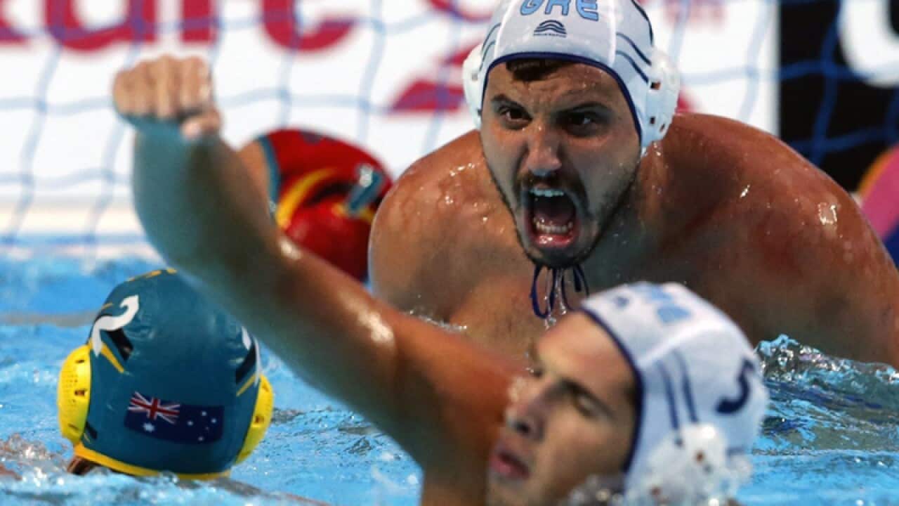 Greece celebrates after scoring against Australia.