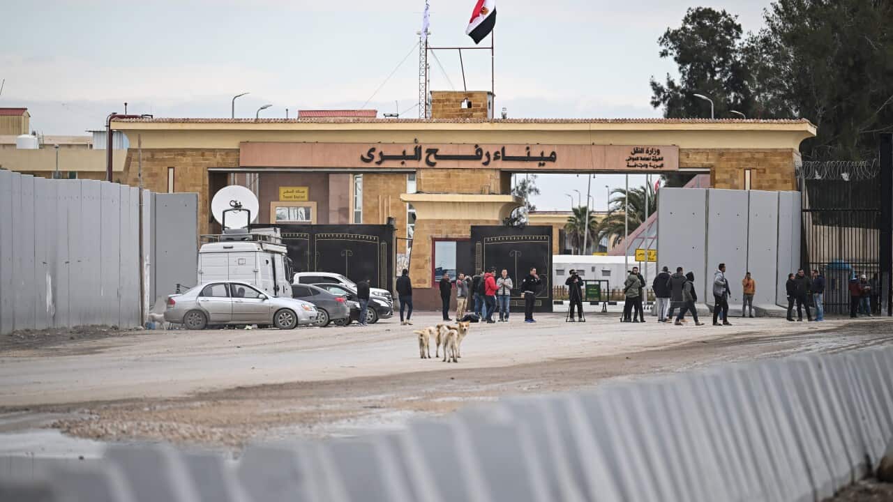 Truck drivers wait to enter Gaza through Egypt's Rafah crossing