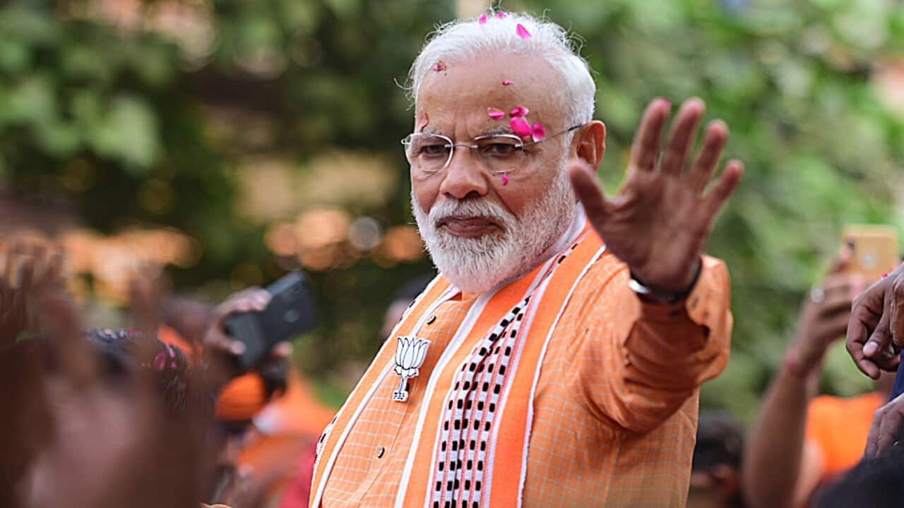 Bhartya Janta party (BJP) leader and Indian Prime Minister Narendra Modi waves to his supporters during a road show in Varanasi, Uttar Pradesh, India, 25 April 2019