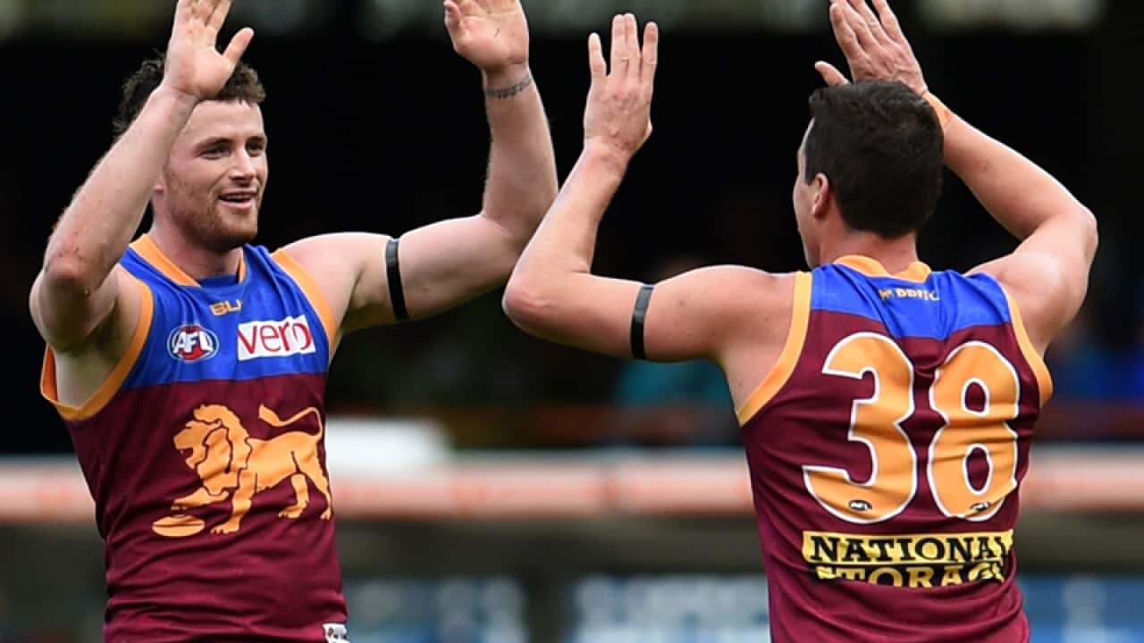 Brisbane Lions players Pearce Hanley (L) and Tom Rockliff