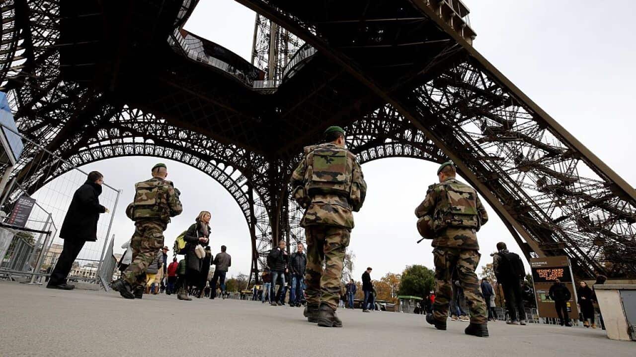 French soldiers patrol the area at the foot of the Eiffel Tower in Paris on November 14, 2015 following a series of coordinated attacks in and around Paris late Friday which left more than 120 people dead. (AFP PHOTO / FRANCOIS GUILLOT)