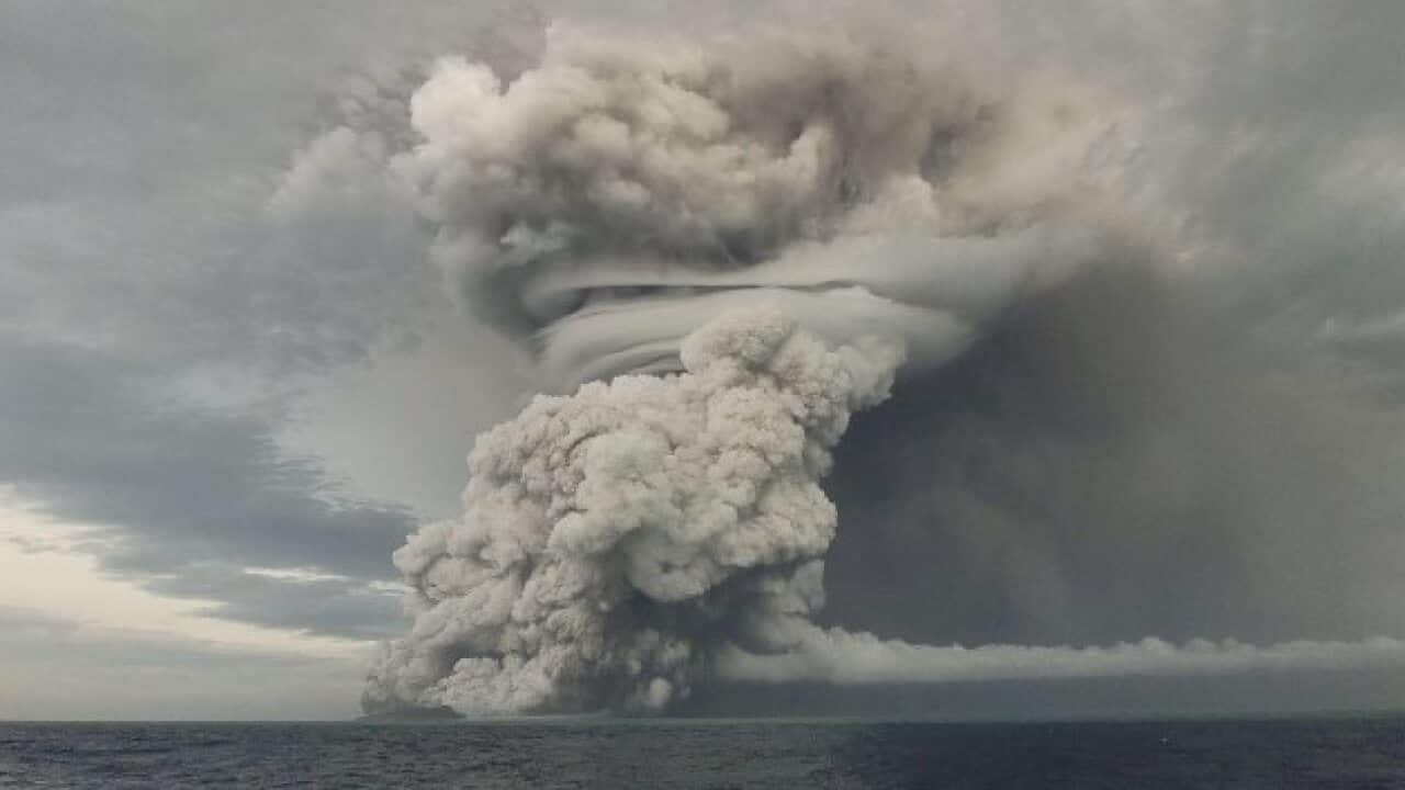 Smoke pours from the volcano on 14 January, one day before its violent eruption.