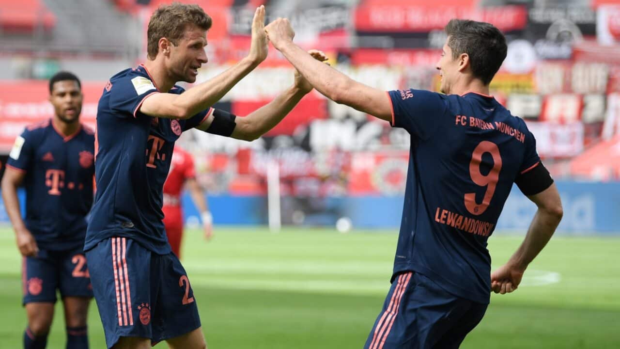 Thomas Muller and Robert Lewandowski celebrate a goal for Bayern Munich
