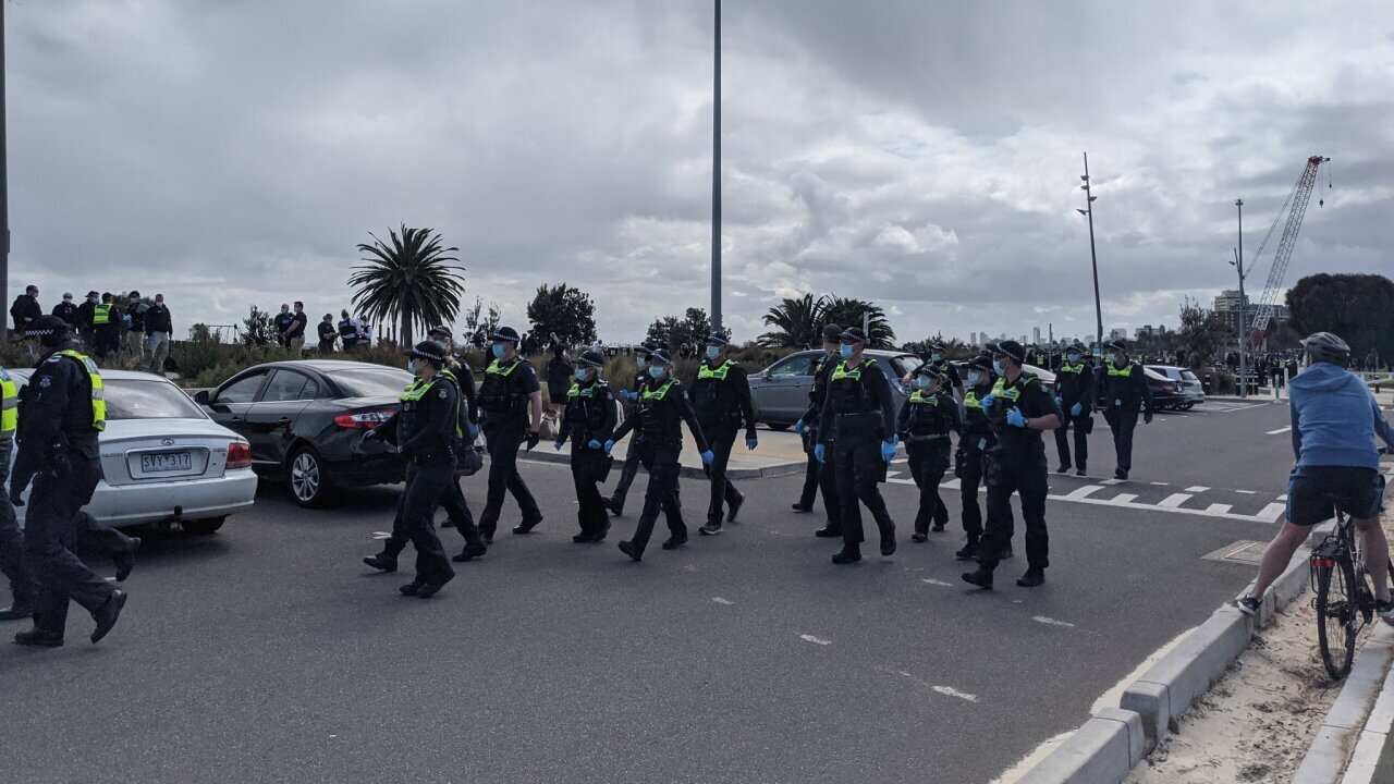 Victoria Police officers patrolled areas of Melbourne as part of measures to contain anti-lockdown protest activity.
